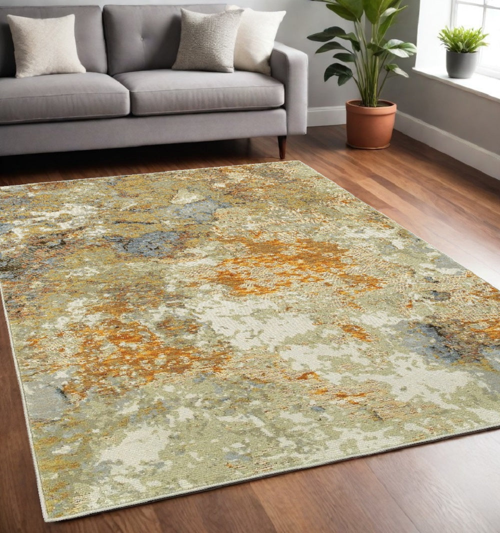 5' X 7' Beige Gold And Ivory Abstract Area Rug