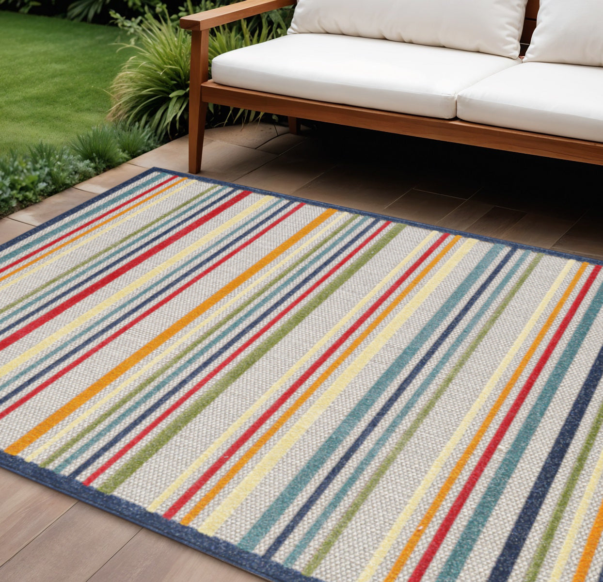 7' X 9' Ivory And Blue Striped Stain Resistant Indoor Outdoor Area Rug