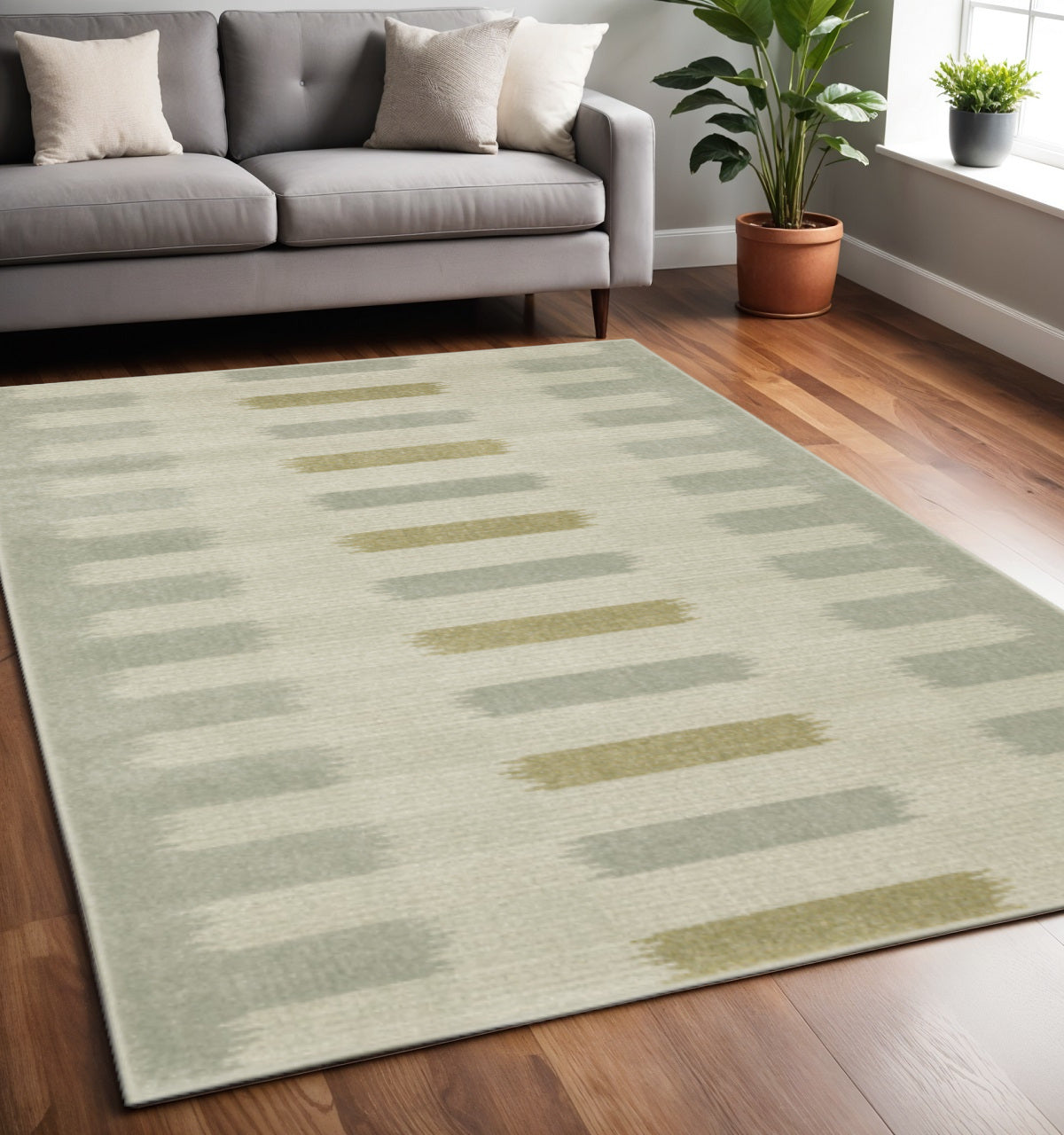 5' X 7' Beige Grey Gold And Green Geometric Power Loom Stain Resistant Area Rug
